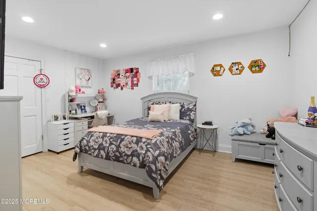 a bedroom with a bed and cabinets