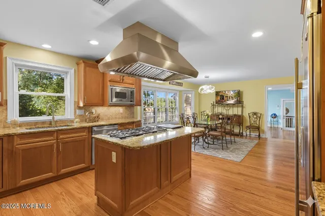 a kitchen with lots of counter top space and dining table