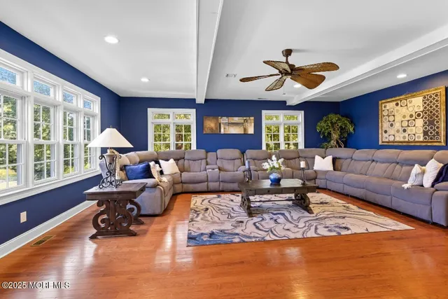 a living room with furniture or couch and a large window