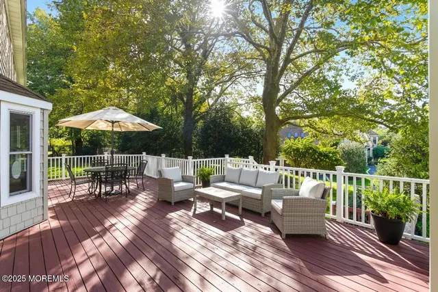 a view of a chairs and tables in the back yard of the house