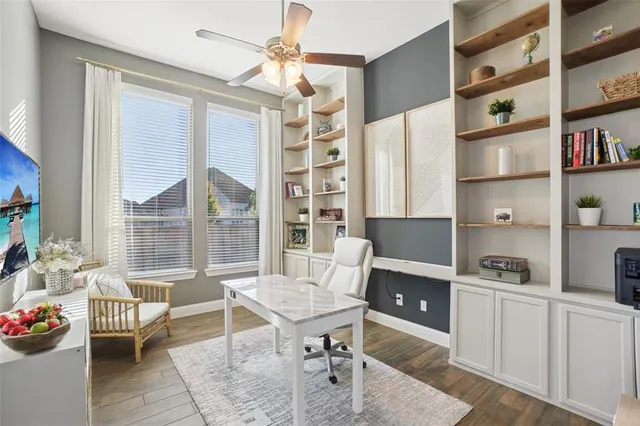 a workspace with furniture and a bookshelf