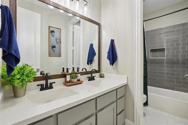 a view of a livingroom with furniture and a window