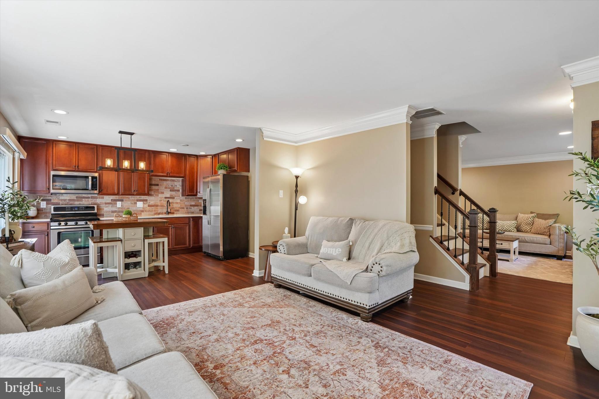 215 Flagstone Road, Unit 1 Chester Springs, PA 19425 - Photo 5 of 33 a living room with furniture and a wooden floor