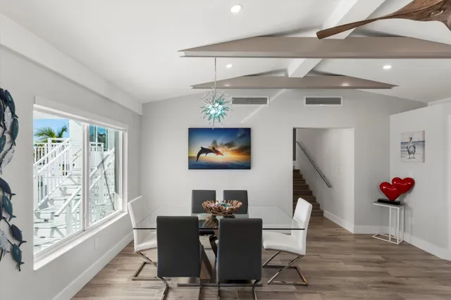 a view of a lake with lawn chairs