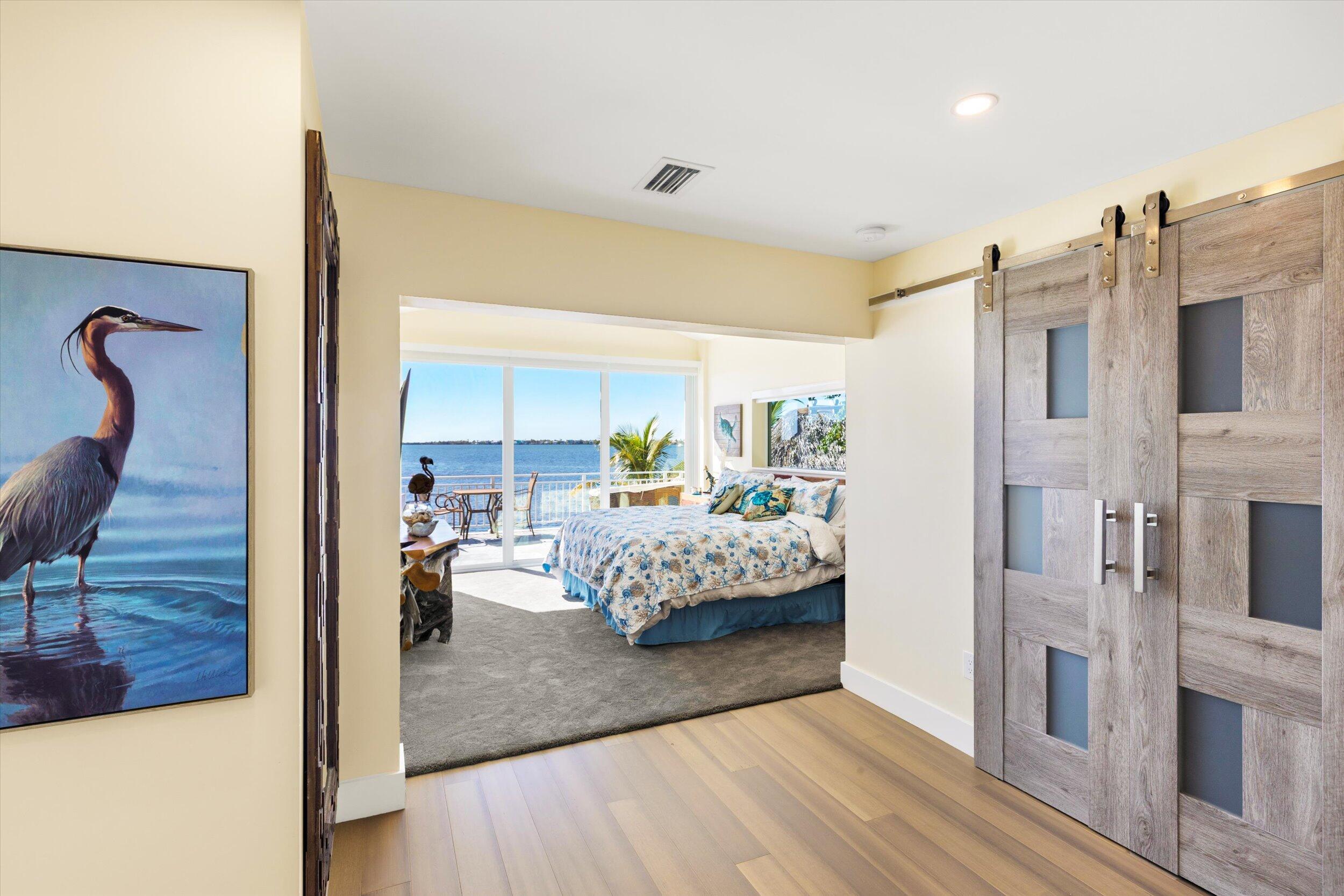 680 Elma Avenue Big Pine Key, FL 33043 - Photo 22 of 89 a bedroom with furniture and a mirror