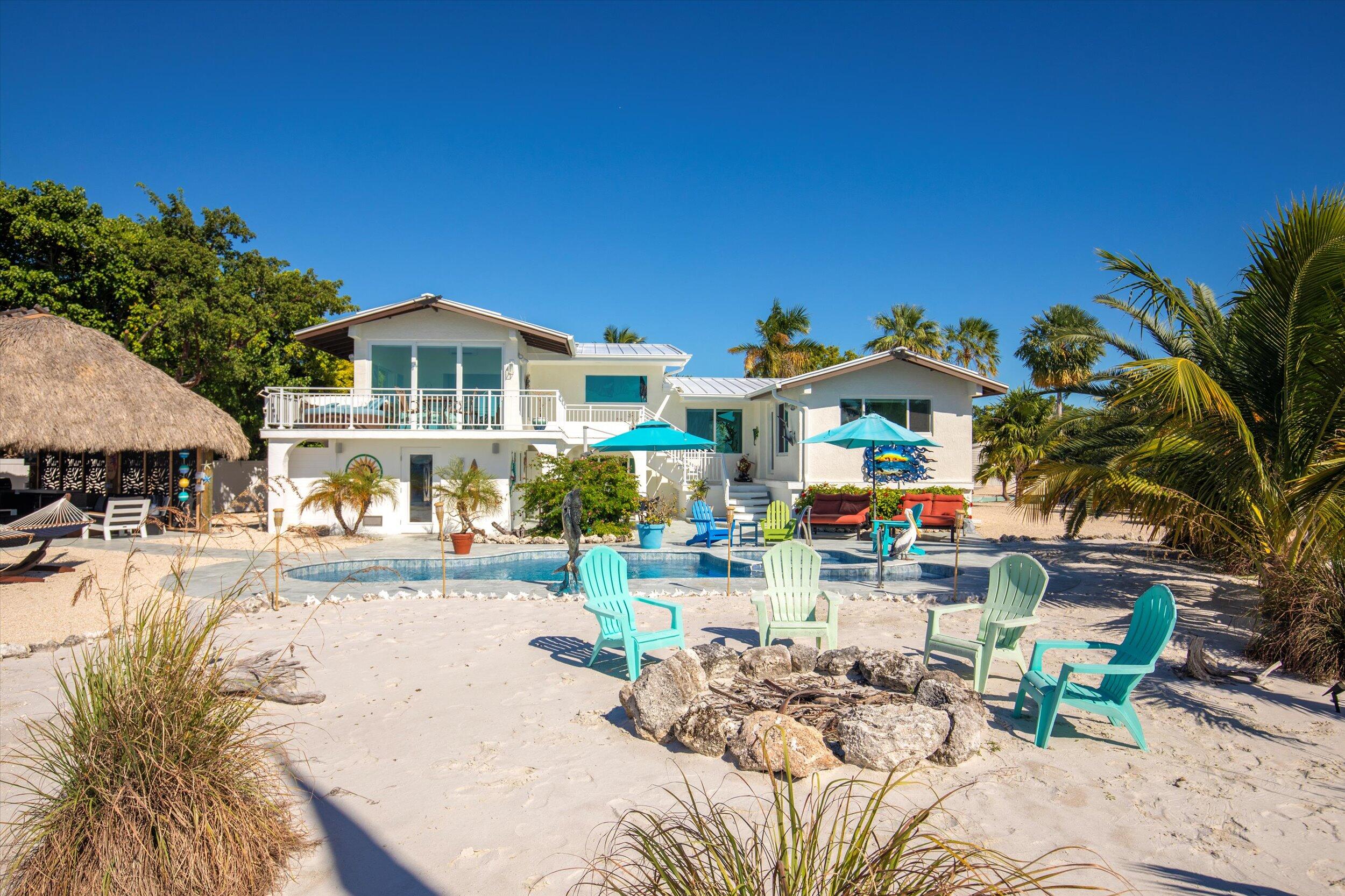 680 Elma Avenue Big Pine Key, FL 33043 - Photo 7 of 89 a view of a chairs and table in patio