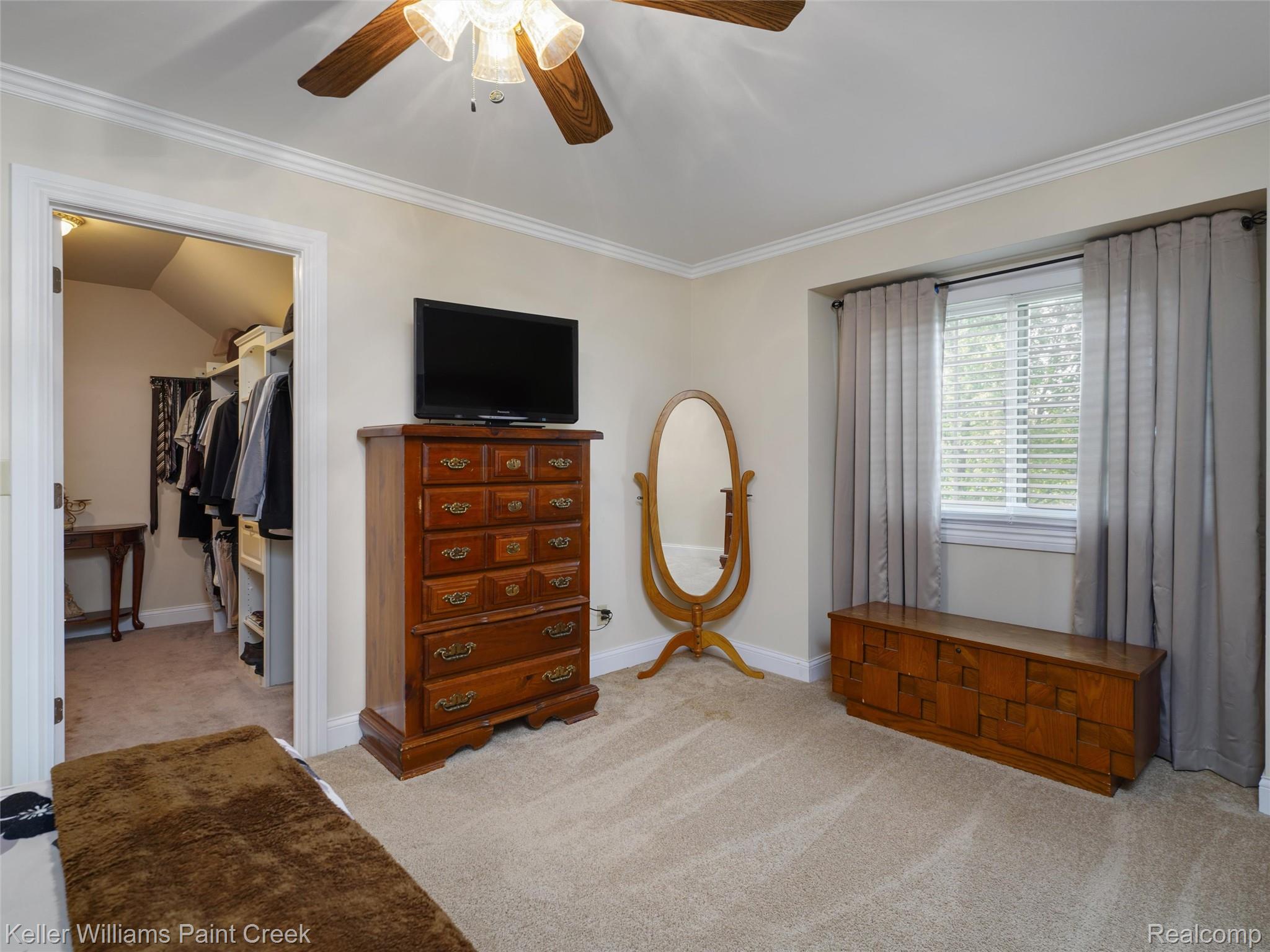 5813 36 Mile Road Romeo, MI 48065 - Photo 18 of 81 Carpeted room featuring a built-in walk-in closet with custom shelving and hanging rods