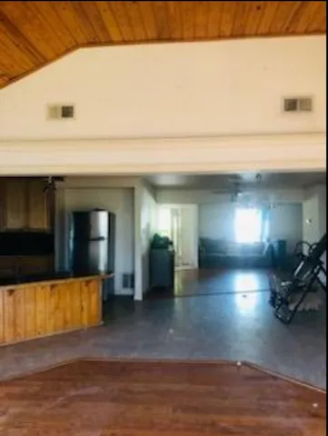 a view of a refrigerator in a kitchen