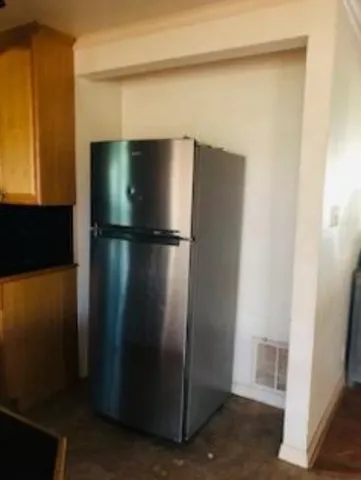 a living room with furniture and a ceiling fan