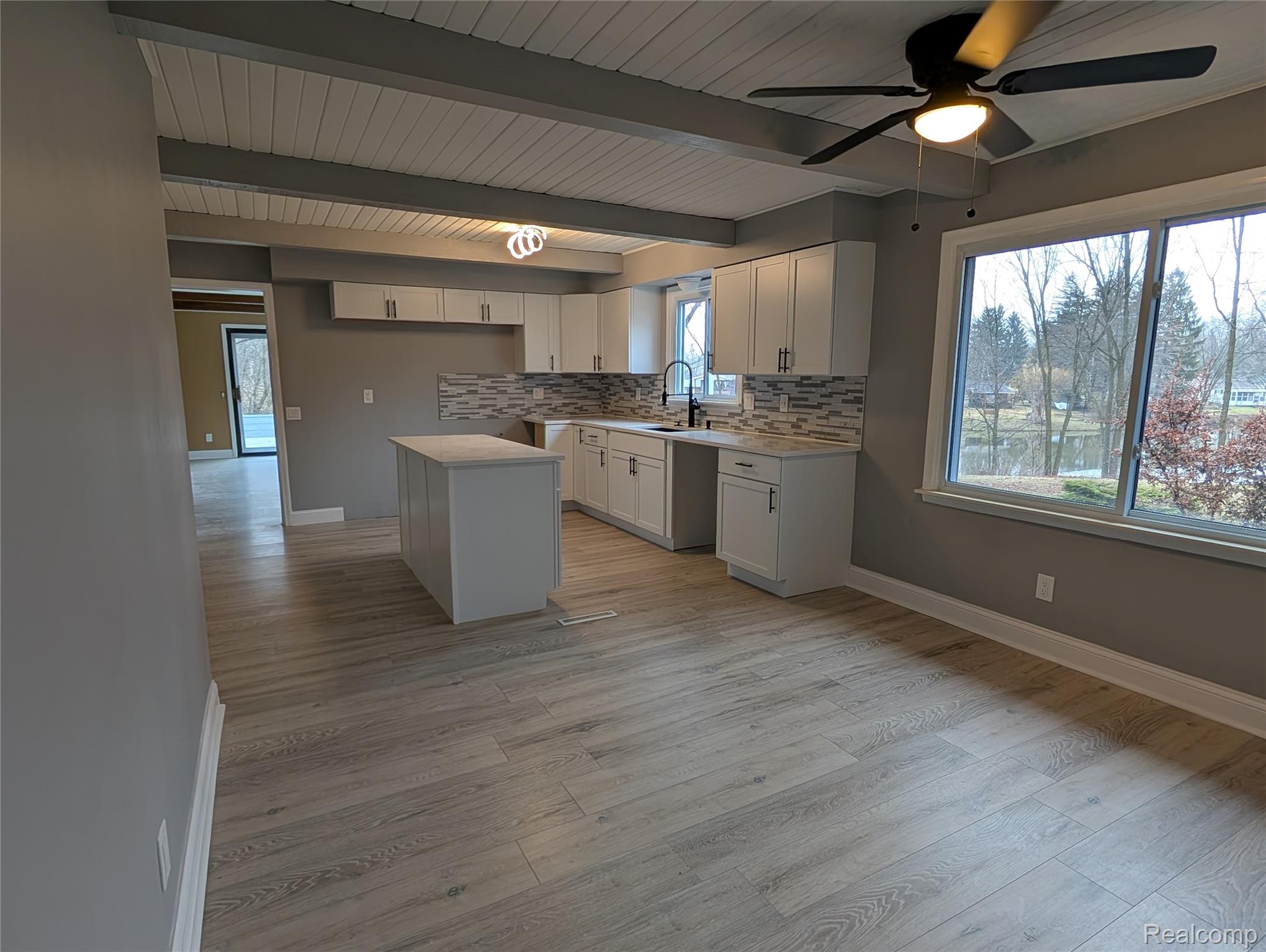 6353 Perry Road Grand Blanc, MI 48439 - Photo 11 of 34 Kitchen featuring plenty of natural light, with large dining area.