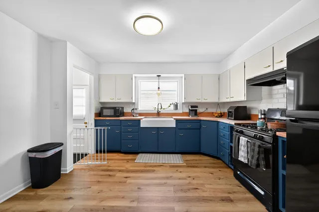 a kitchen with stainless steel appliances granite countertop a stove a sink dishwasher and a refrigerator