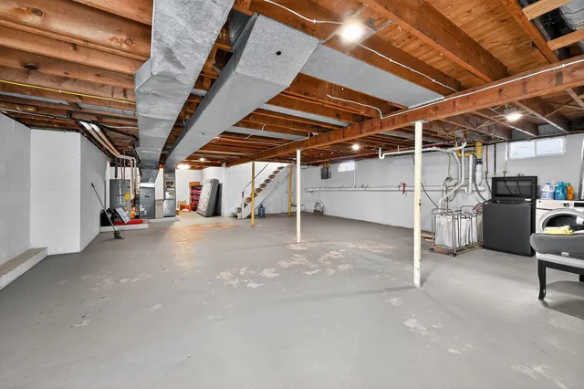 a view of empty room with wooden ceiling