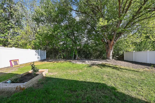 a swimming pool with wooden fence