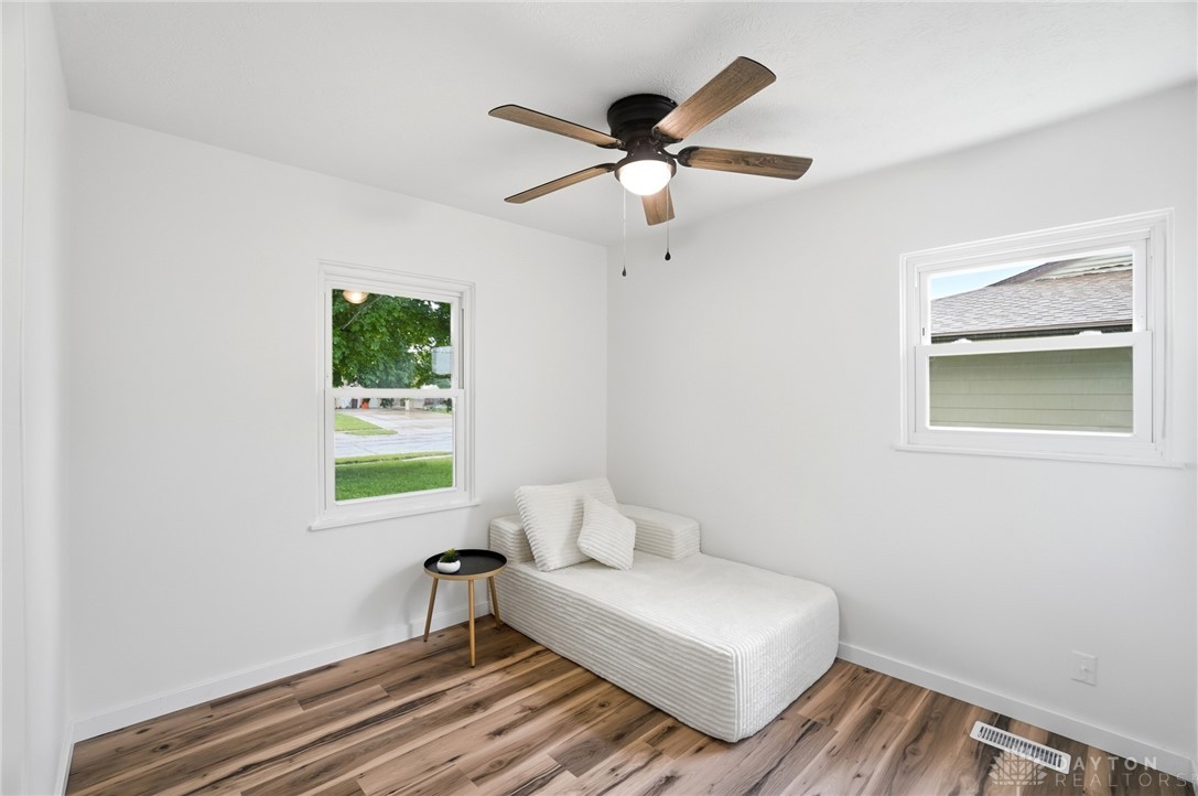 1923 Portage Path Springfield, OH 45506 - Photo 25 of 40 A well-lit bedroom featuring durable hardwood flooring and a stylish ceiling fan.