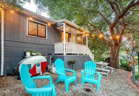 a front view of house with outdoor seating