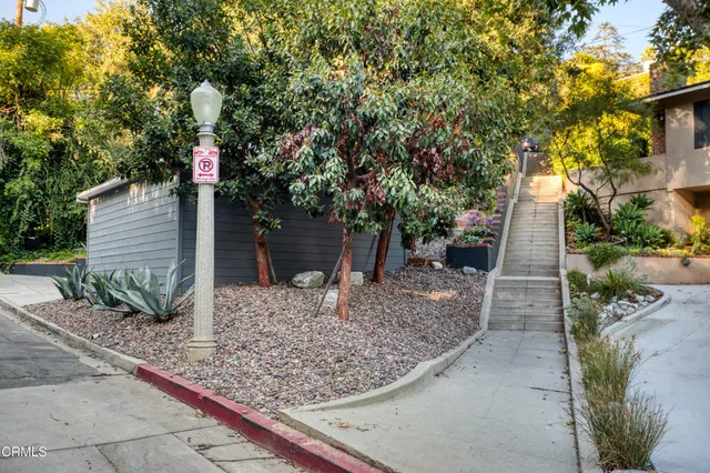 a view of street with small yard