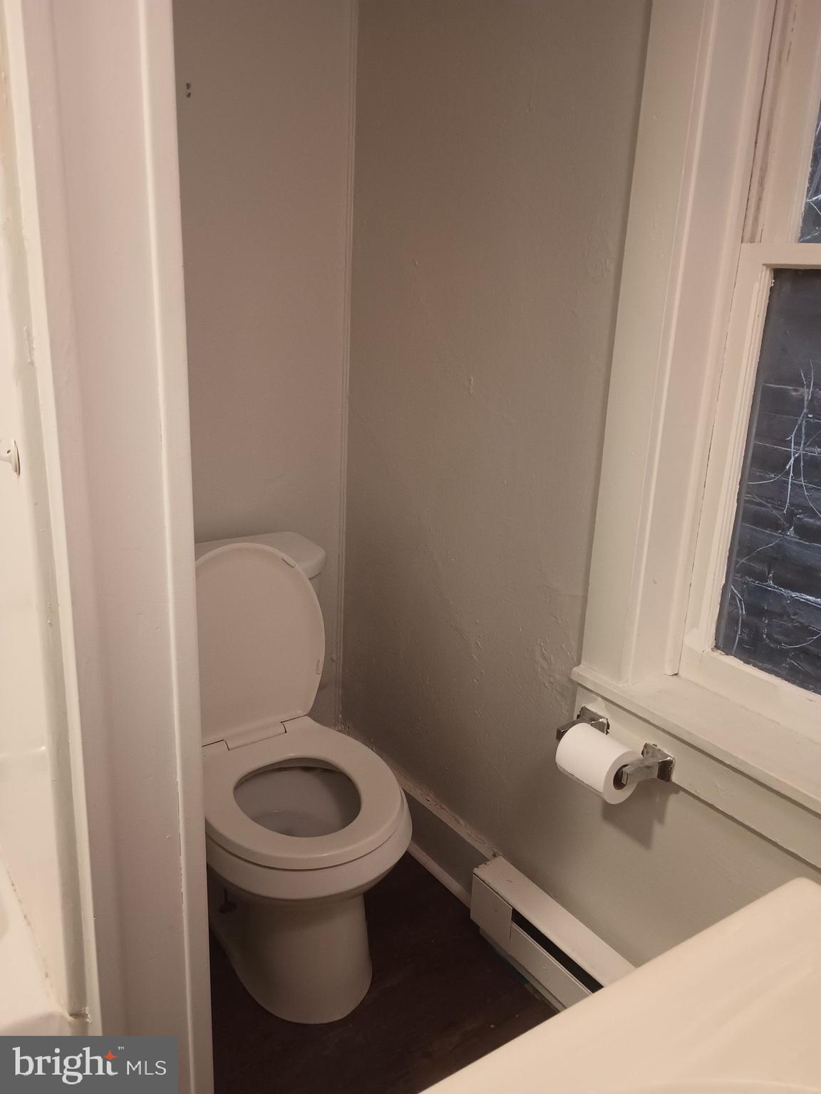 132 East Main Street, Unit D Middletown, PA 17057 - Photo 7 of 7 a toilet sitting in a bathroom next to a sink
