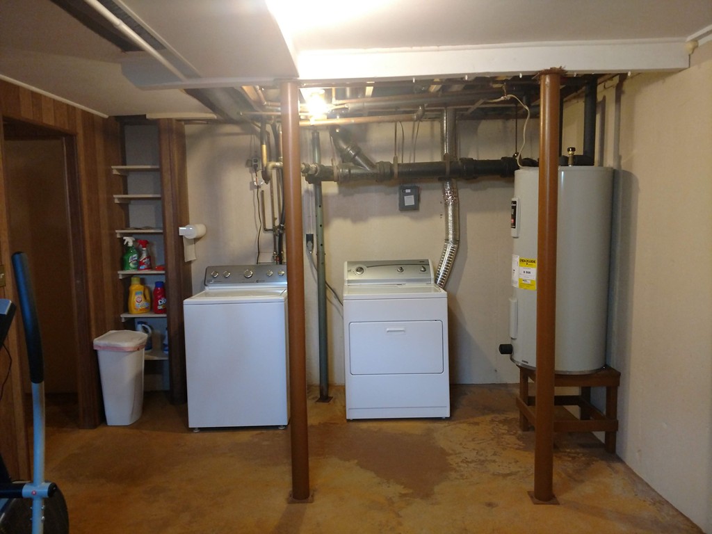 683 Old Post Road, Unit 18 Dennis, MA 02638 - Photo 20 of 25 a utility room with dryer and washer