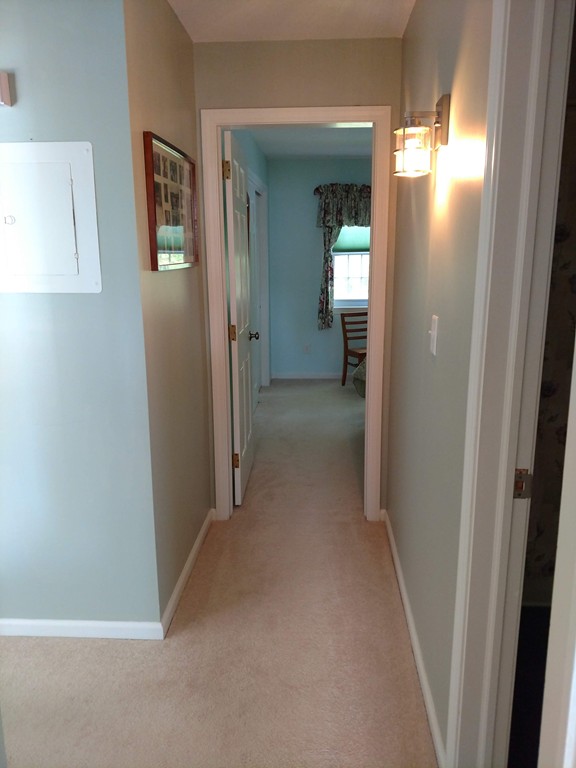 683 Old Post Road, Unit 18 Dennis, MA 02638 - Photo 9 of 25 a view of hallway with bathroom