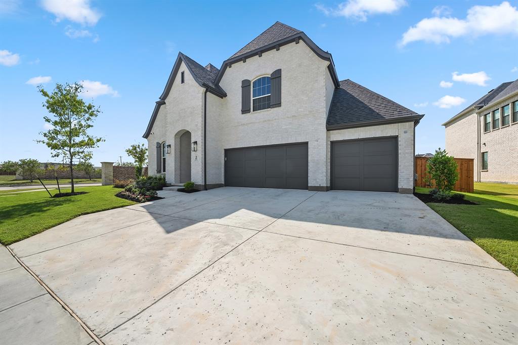 587 Mayfair Lane Frisco, TX 75033 - Photo 3 of 37 a view of a house with a yard