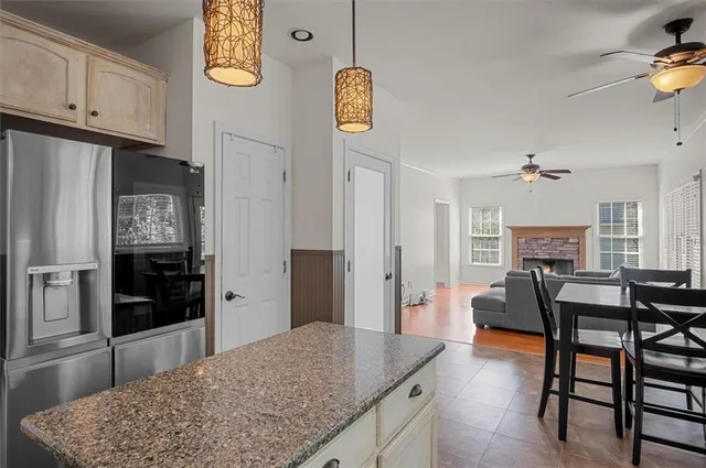 a living room with kitchen island furniture and a kitchen view