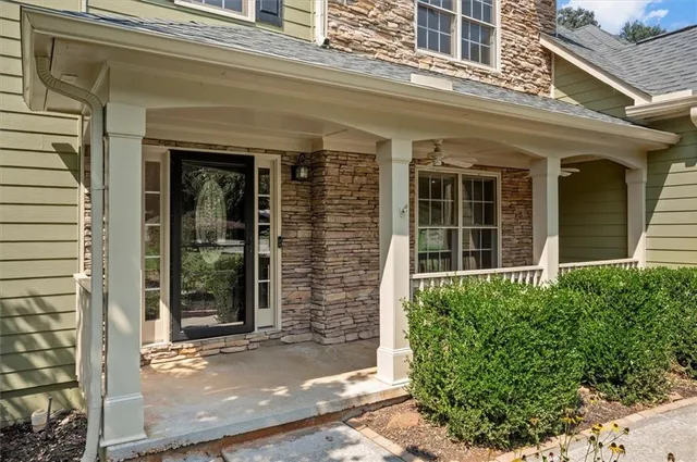 front view of a brick house with a large window