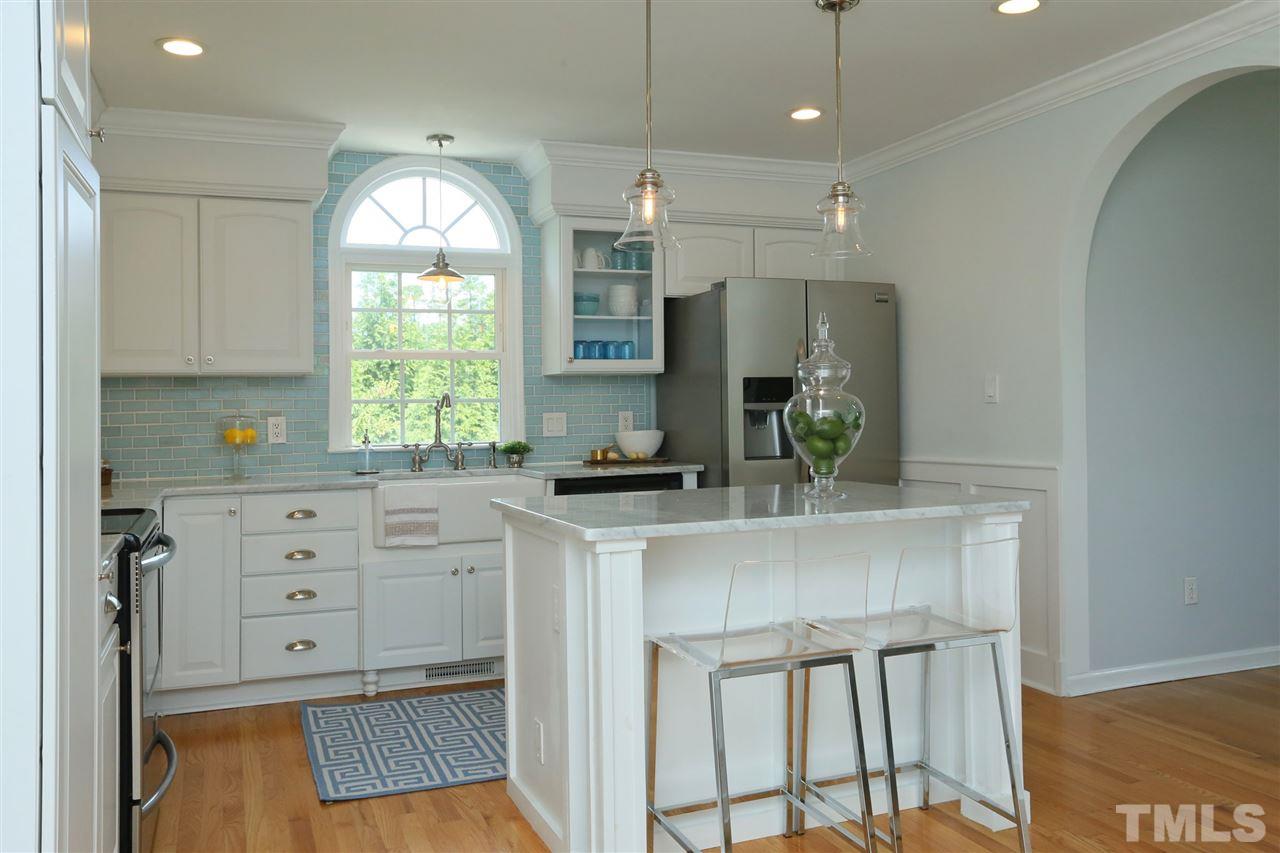 2001 Edgemont Road Wendell, NC 27591 - Photo 11 of 30 a kitchen with white cabinets and window