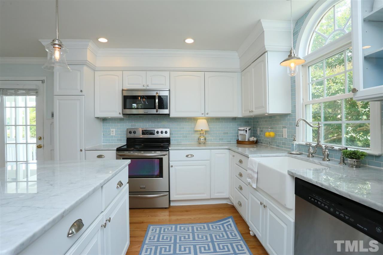 2001 Edgemont Road Wendell, NC 27591 - Photo 12 of 30 a kitchen with granite countertop a stove a sink and a microwave