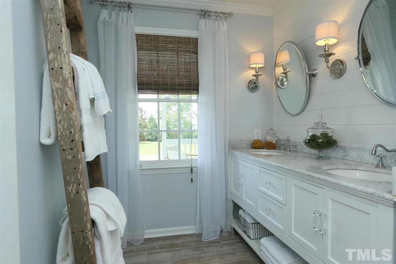 2001 Edgemont Road Wendell, NC 27591 - Photo 15 of 30 a bathroom with a granite countertop sink vanity granite and a mirror