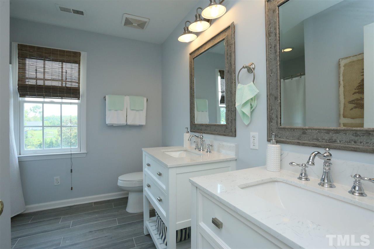 2001 Edgemont Road Wendell, NC 27591 - Photo 18 of 30 a bathroom with a sink and a mirror