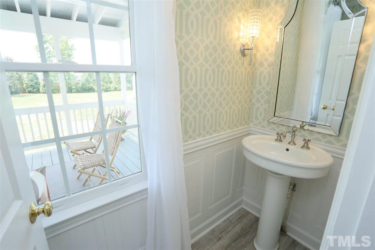 2001 Edgemont Road Wendell, NC 27591 - Photo 20 of 30 a bathroom with a sink a mirror and a shower