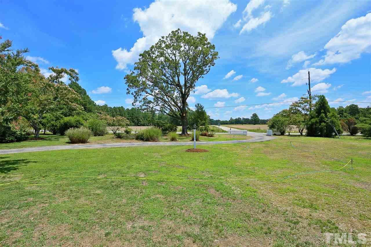 2001 Edgemont Road Wendell, NC 27591 - Photo 26 of 30 a view of a field of grass and trees