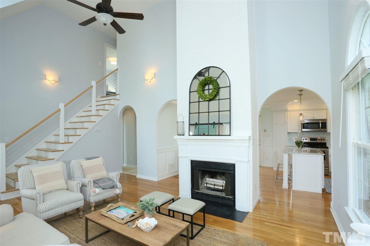 2001 Edgemont Road Wendell, NC 27591 - Photo 4 of 30 a living room with furniture a rug and a fireplace