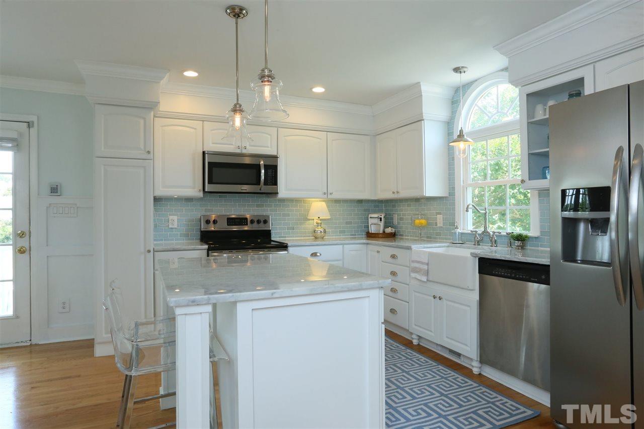 2001 Edgemont Road Wendell, NC 27591 - Photo 10 of 30 a kitchen with a sink a counter top space stainless steel appliances and a window