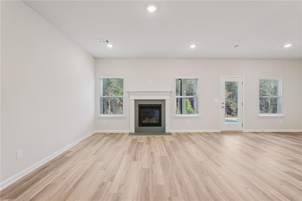 7204 Ensemble Court Fairburn, GA 30213 - Photo 11 of 56 a view of an empty room with window and fire place