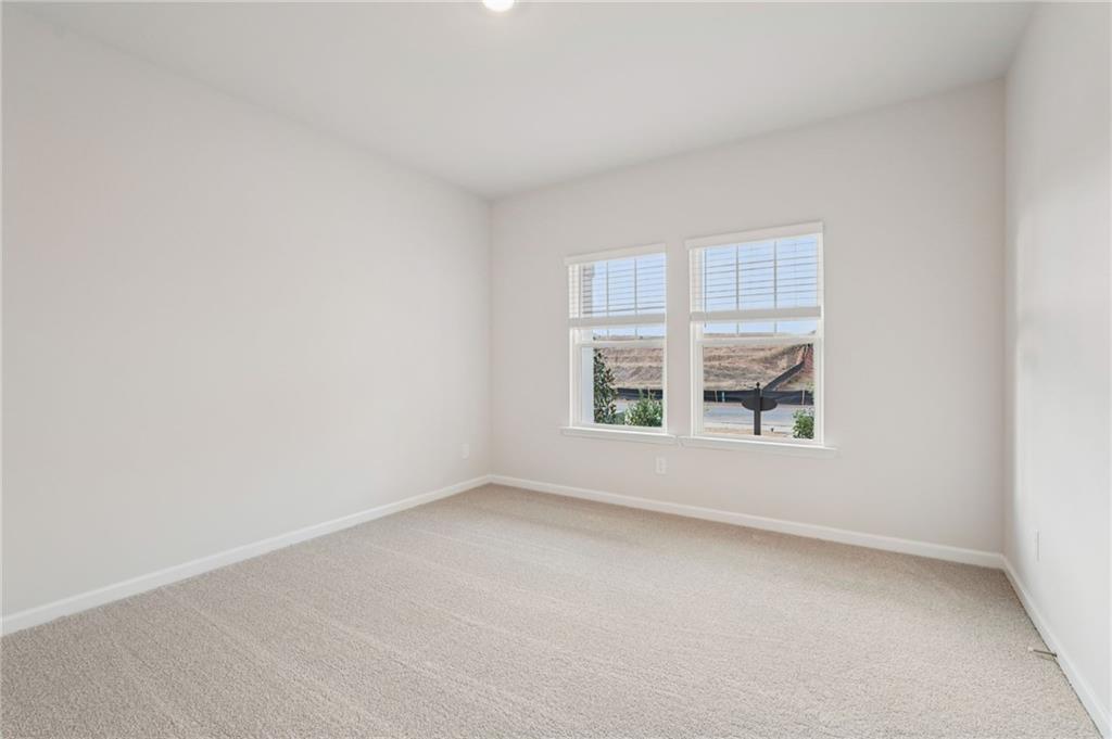 7204 Ensemble Court Fairburn, GA 30213 - Photo 20 of 56 an empty room with a window
