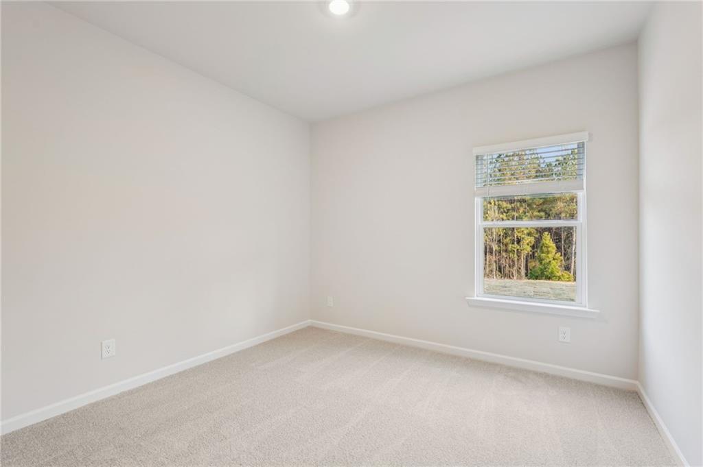 7204 Ensemble Court Fairburn, GA 30213 - Photo 23 of 56 an empty room with a window