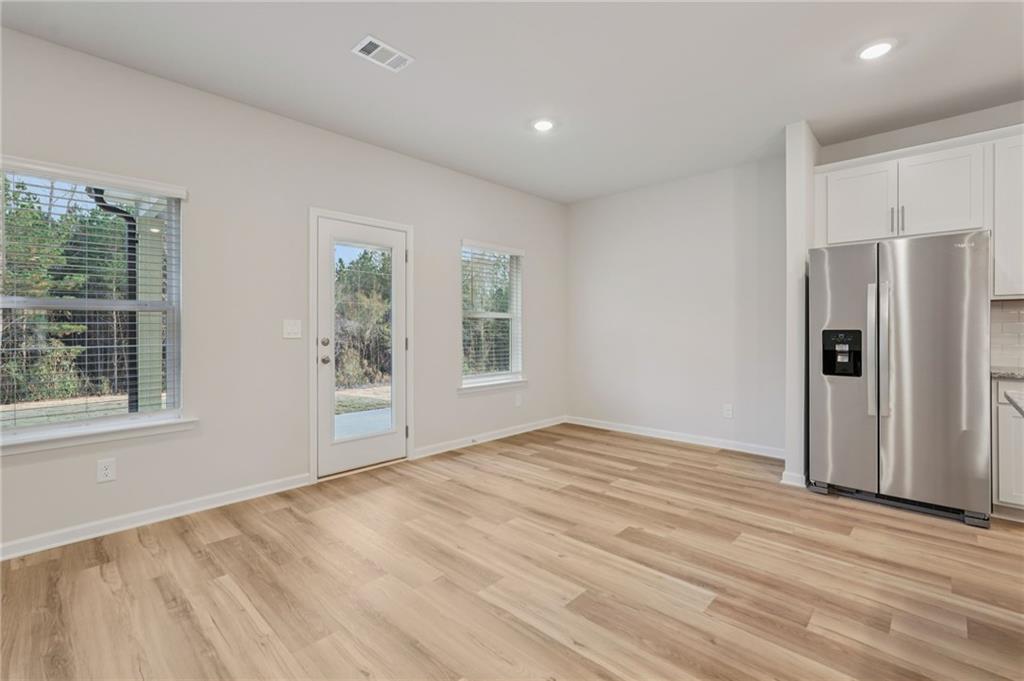 7204 Ensemble Court Fairburn, GA 30213 - Photo 4 of 56 a view of an empty room with a window