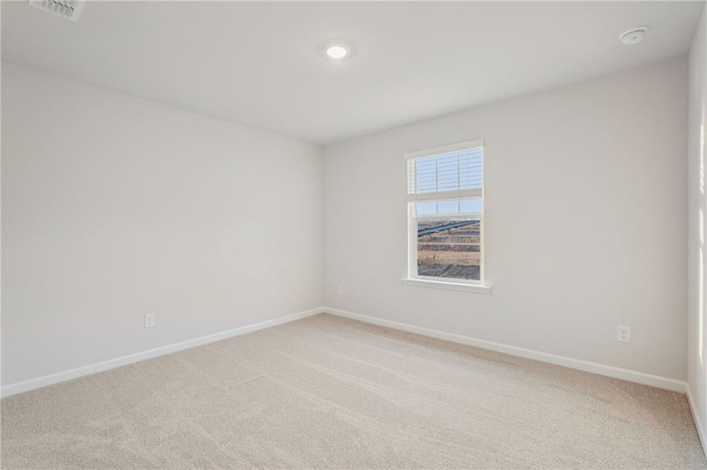 7204 Ensemble Court Fairburn, GA 30213 - Photo 42 of 56 an empty room with a window