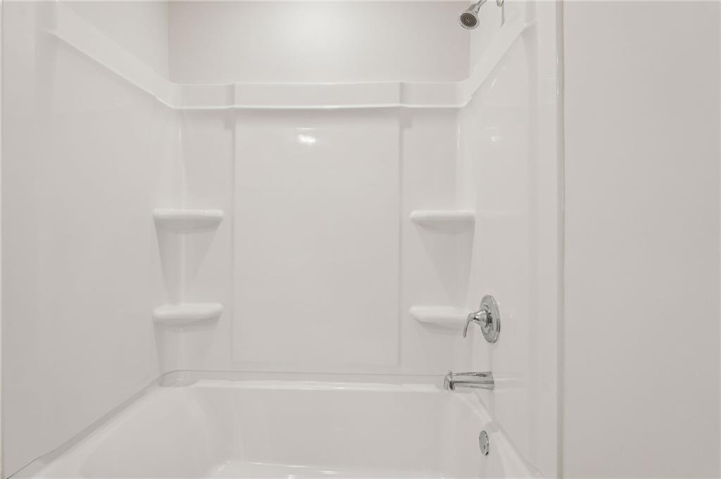 7204 Ensemble Court Fairburn, GA 30213 - Photo 47 of 56 a bathroom with a shower