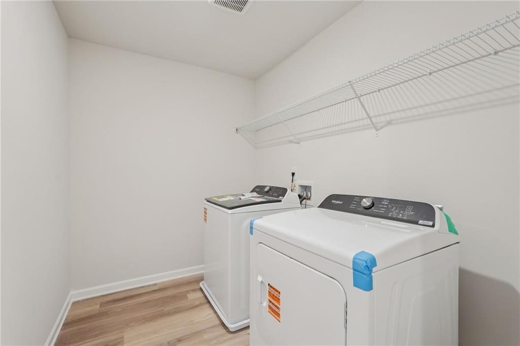7204 Ensemble Court Fairburn, GA 30213 - Photo 49 of 56 a utility room with dryer and washer