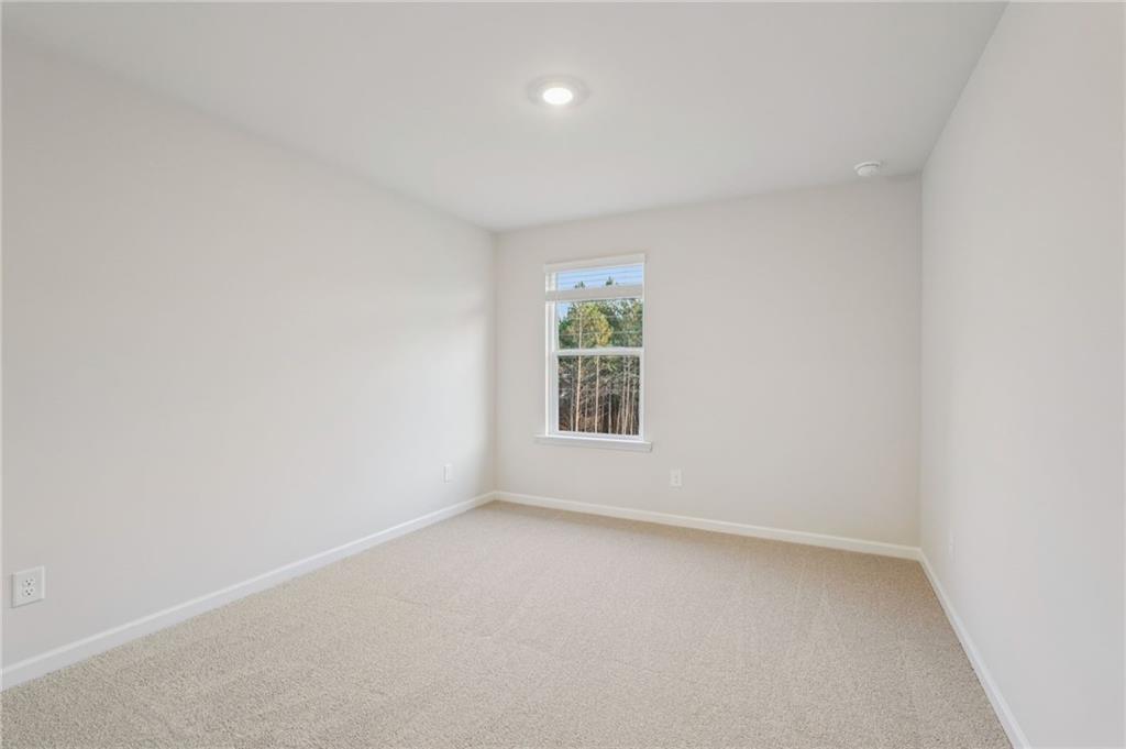 7204 Ensemble Court Fairburn, GA 30213 - Photo 50 of 56 an empty room with a window