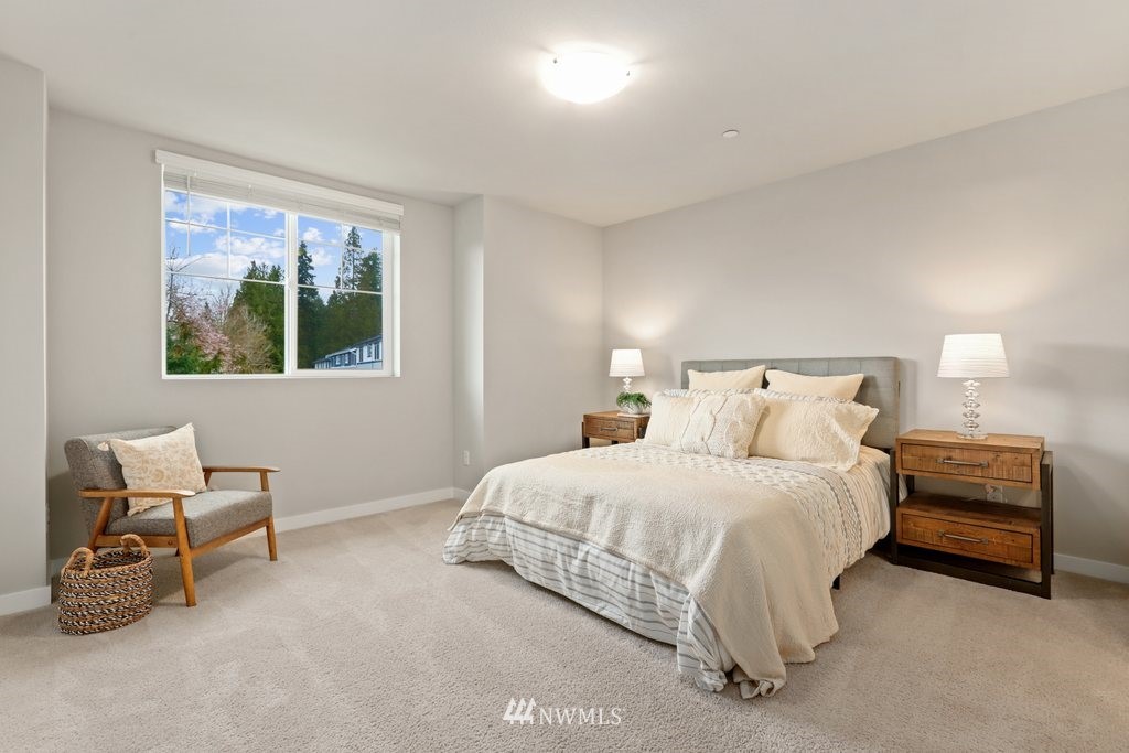 1621 Seattle Hill Road, Unit Z2 Bothell, WA 98012 - Photo 21 of 35 a bedroom with a bed and a chair