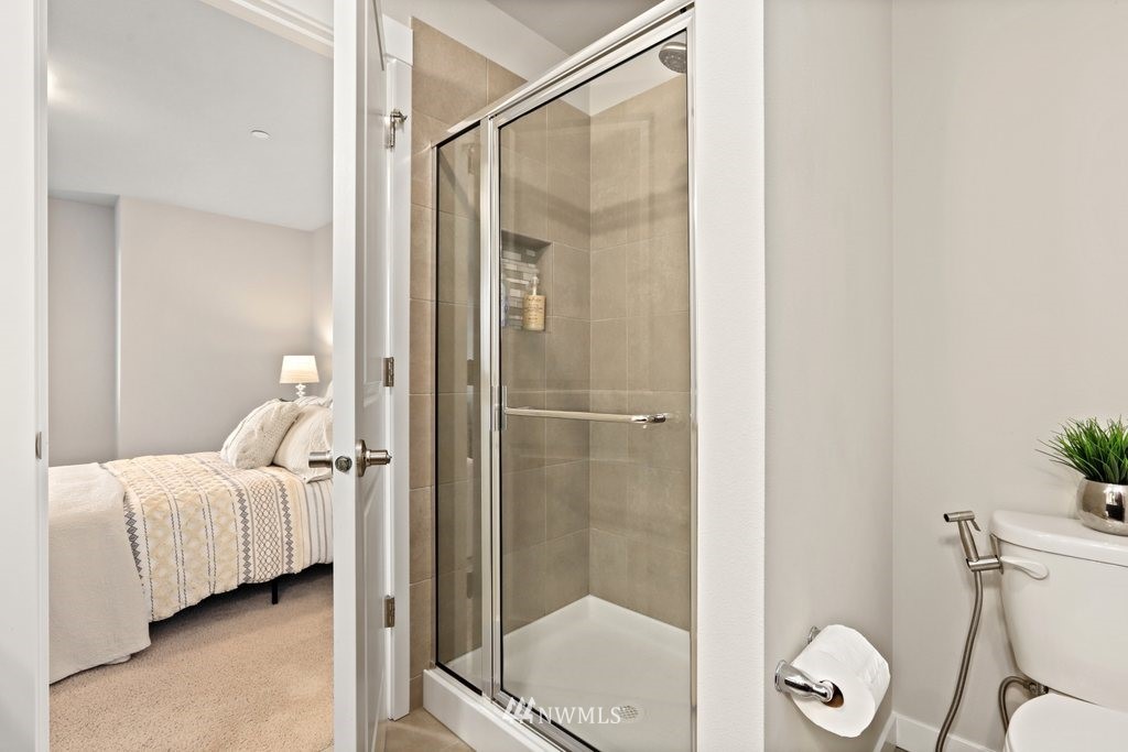 1621 Seattle Hill Road, Unit Z2 Bothell, WA 98012 - Photo 22 of 35 a bathroom with a toilet and a shower