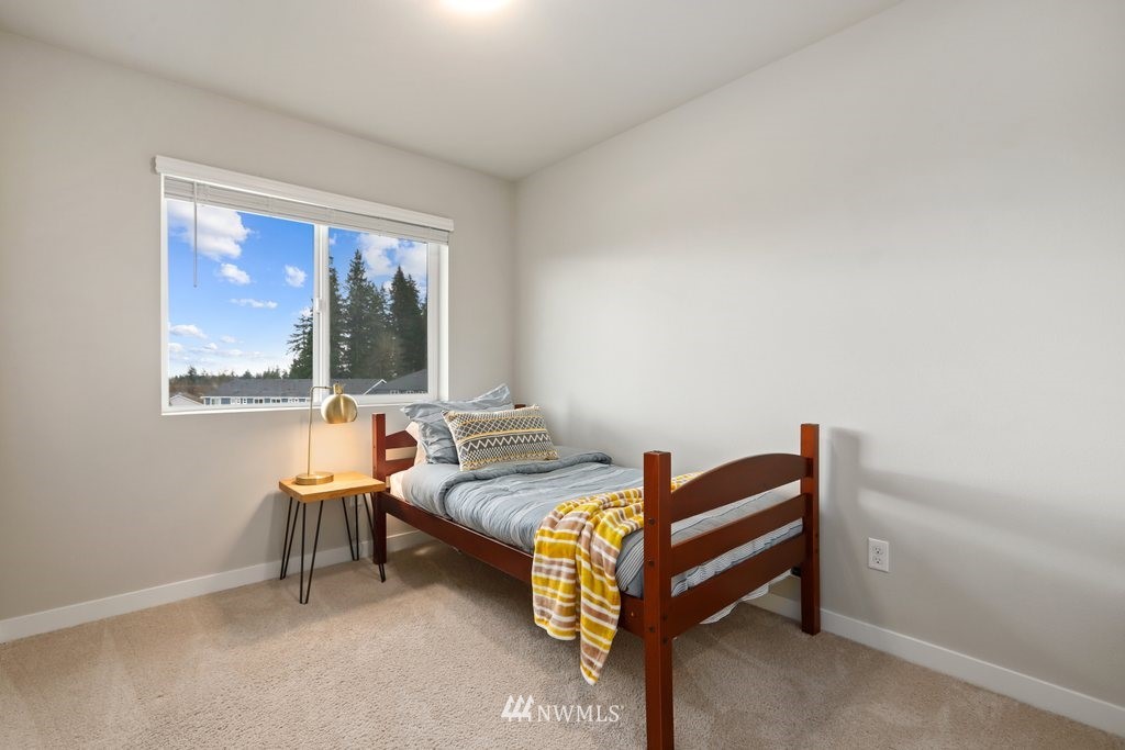 1621 Seattle Hill Road, Unit Z2 Bothell, WA 98012 - Photo 25 of 35 a bedroom with furniture and a window
