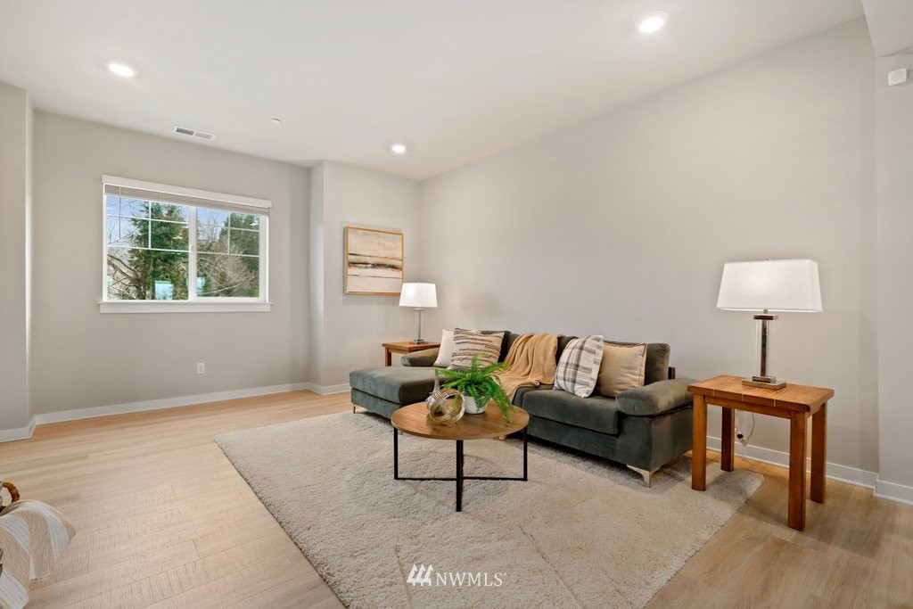 1621 Seattle Hill Road, Unit Z2 Bothell, WA 98012 - Photo 3 of 35 a living room with furniture a lamp and a window