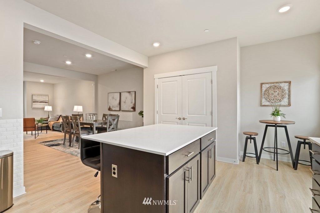 1621 Seattle Hill Road, Unit Z2 Bothell, WA 98012 - Photo 10 of 35 a large kitchen with kitchen island a sink table and chairs