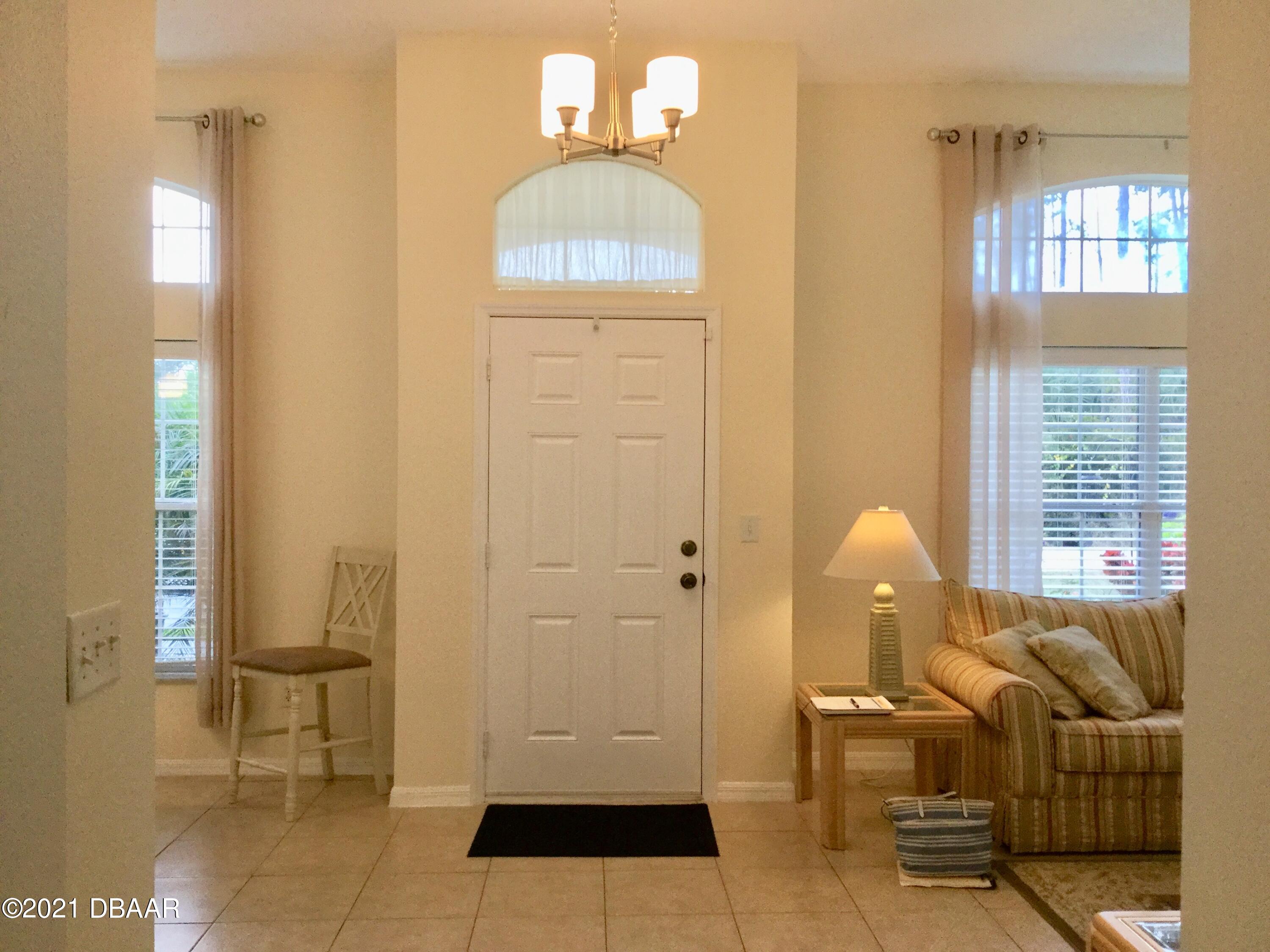 40 Riverside Lane Palm Coast, FL 32164 - Photo 17 of 47 a living room with furniture and a window