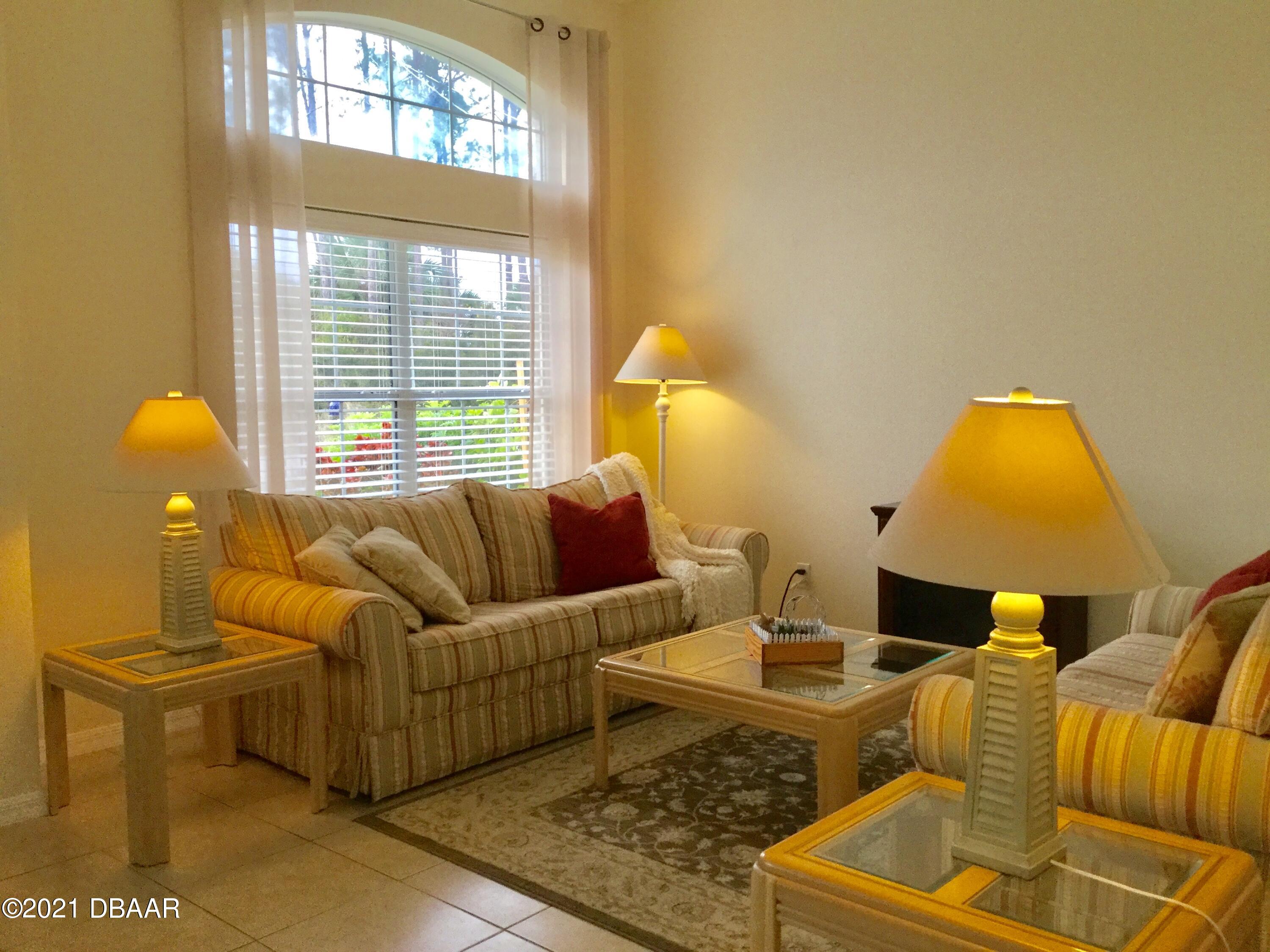 40 Riverside Lane Palm Coast, FL 32164 - Photo 18 of 47 a living room with furniture and a window