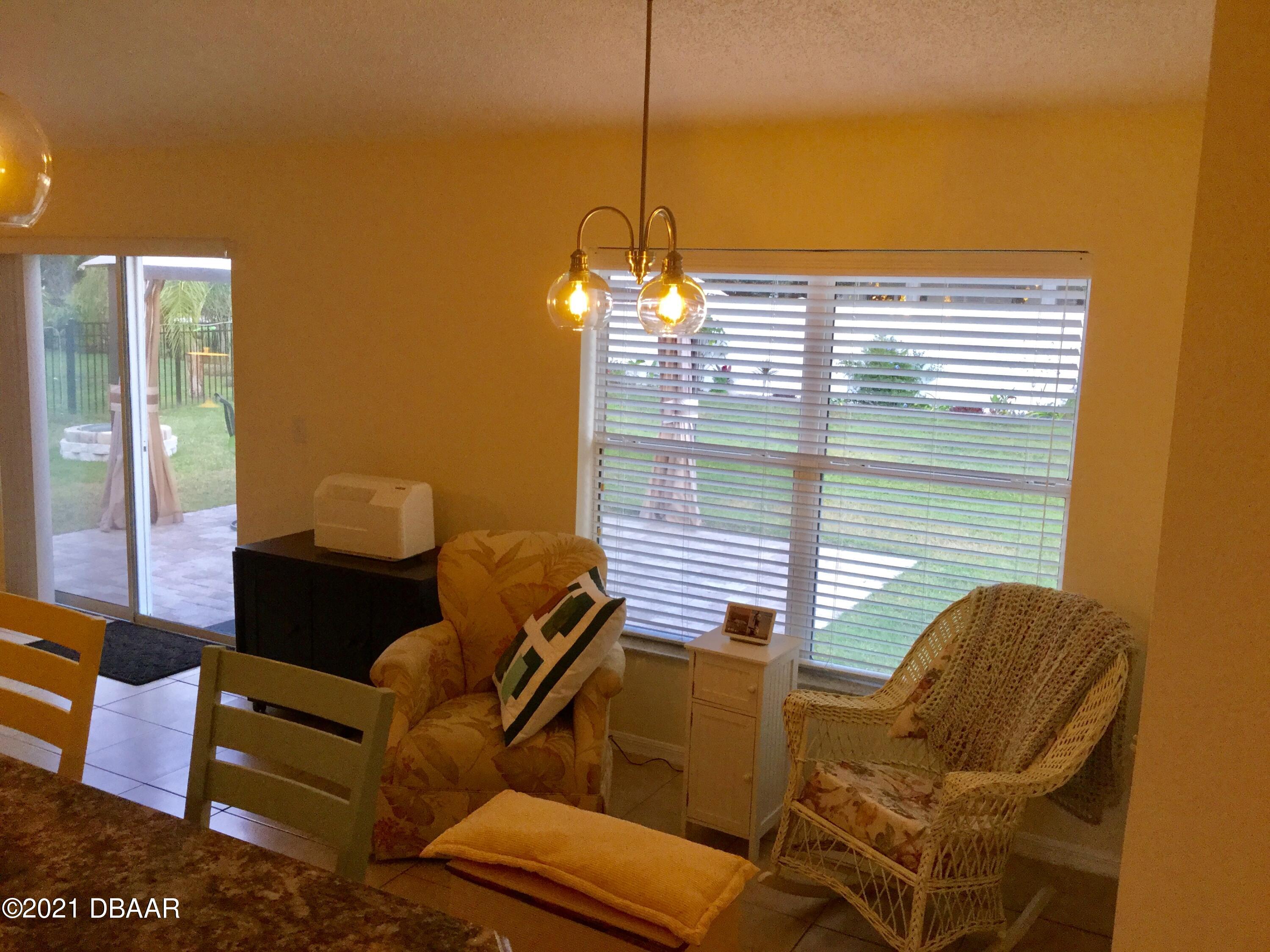 40 Riverside Lane Palm Coast, FL 32164 - Photo 34 of 47 a view of a livingroom with furniture and windows
